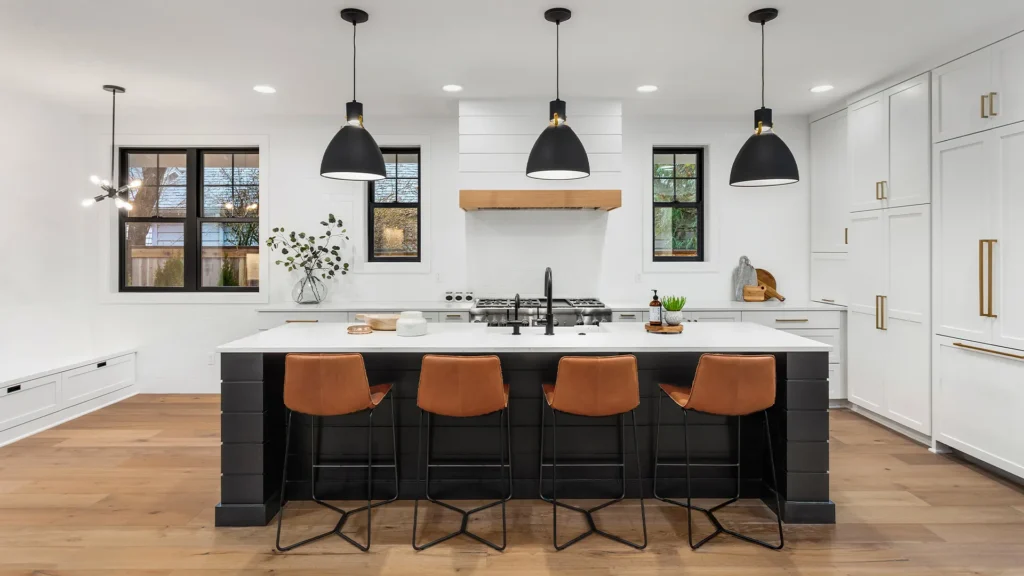 Luxury kitchen remodel in Los Angeles featuring custom white cabinetry, a blue island, quartz countertops, and designer lighting
