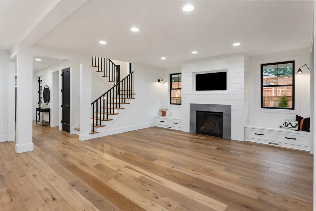 Home remodeling Encino with living room fireplace and hardwood flooring, Athenian Builders