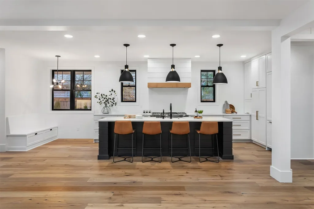 Kitchen remodeling Woodland Hills with large kitchen island and hardwood flooring, Athenian Builders