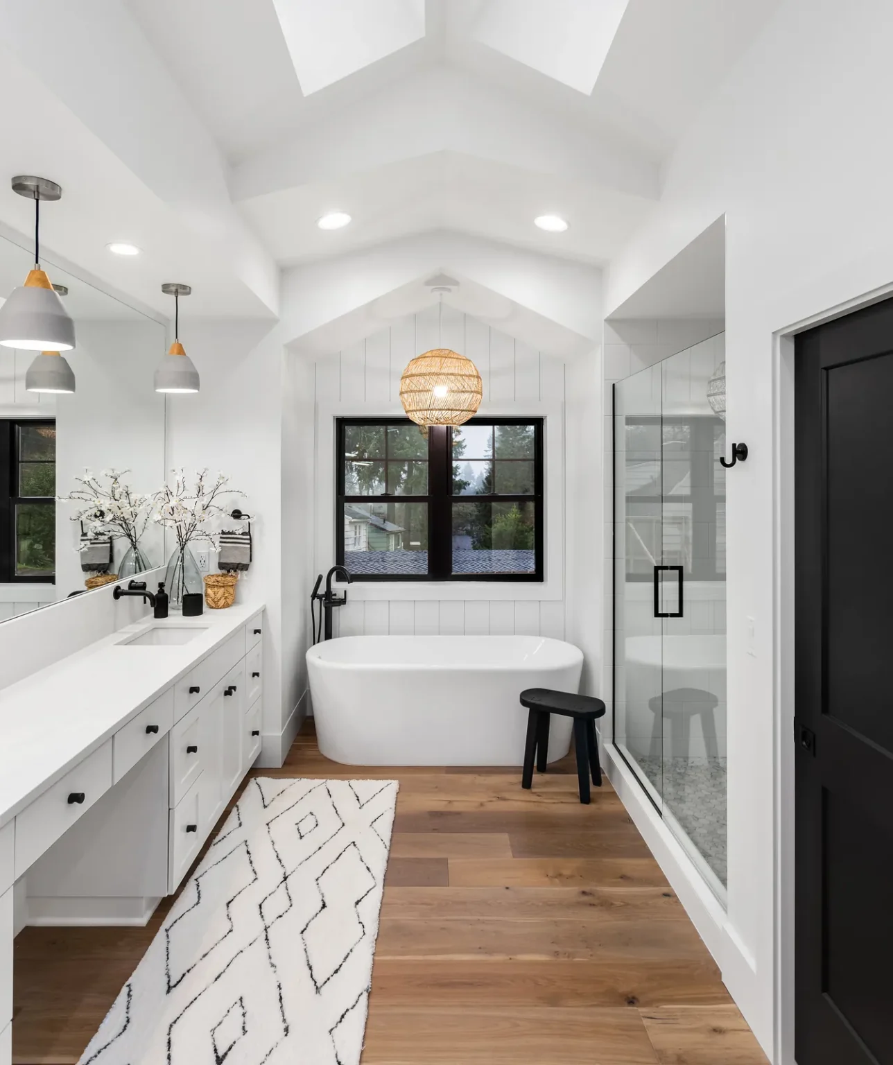 Bathroom soaking tub vaulted ceiling skylights in West Hollywood by Athenian Builders