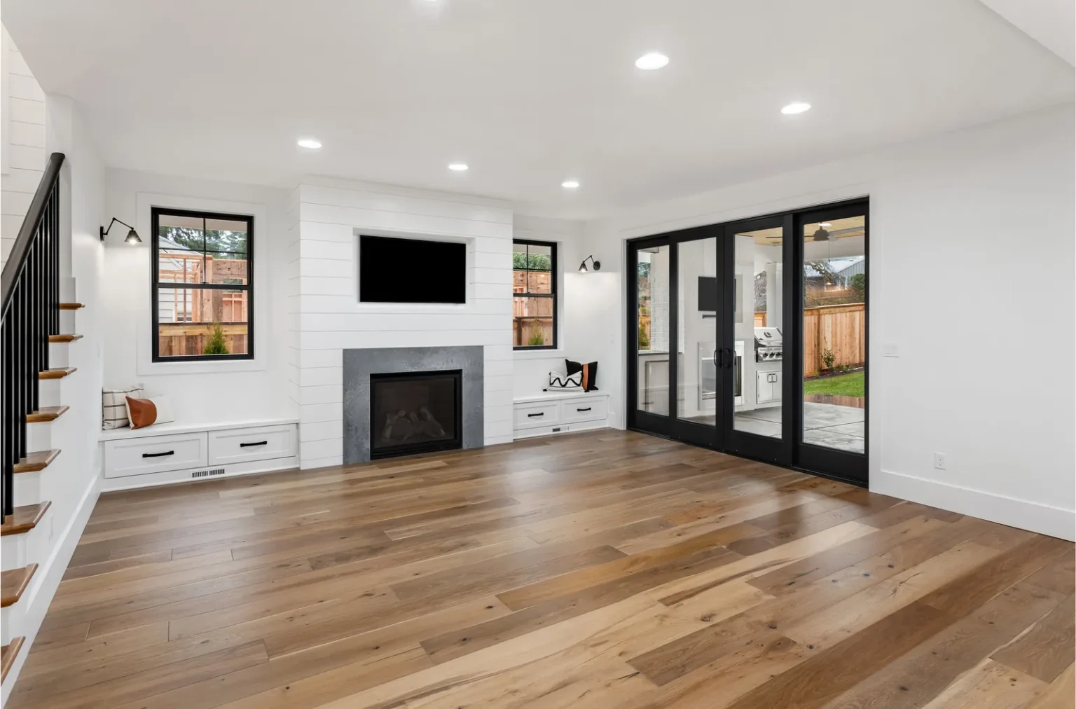 Family room black framed sliding patio doors in West Hollywood by Athenian Builders