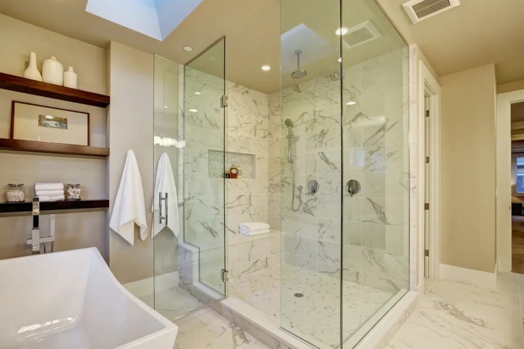 Frameless glass marble shower in Santa Monica by Athenian Builders