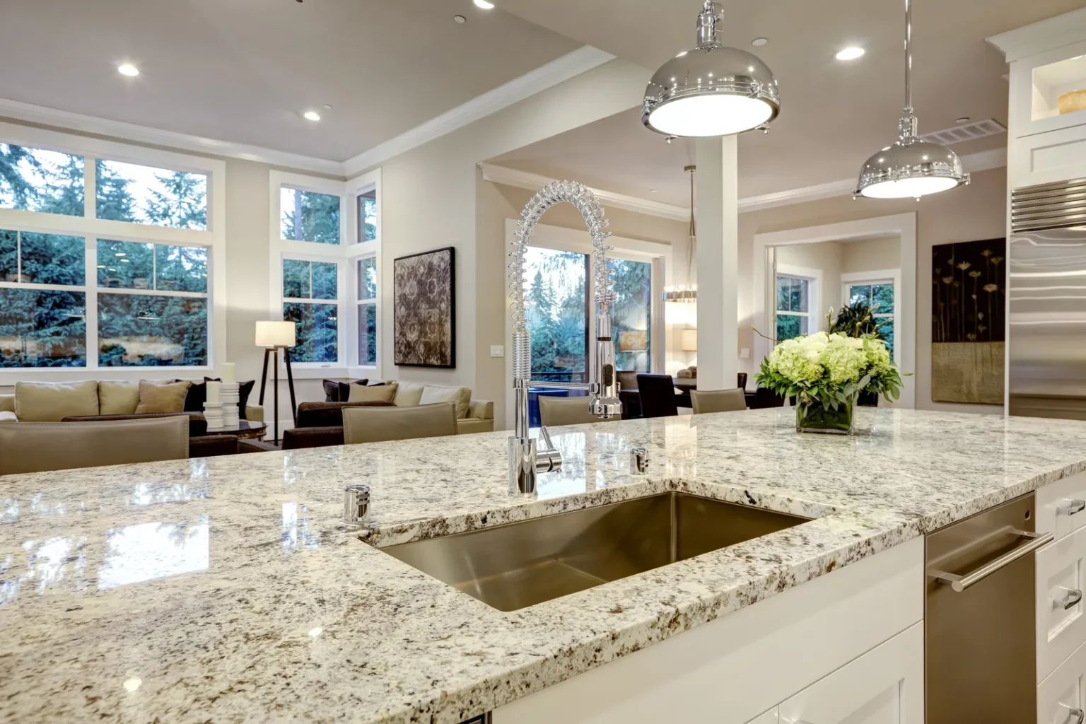 Granite island sink open living area in Studio City by Athenian Builders