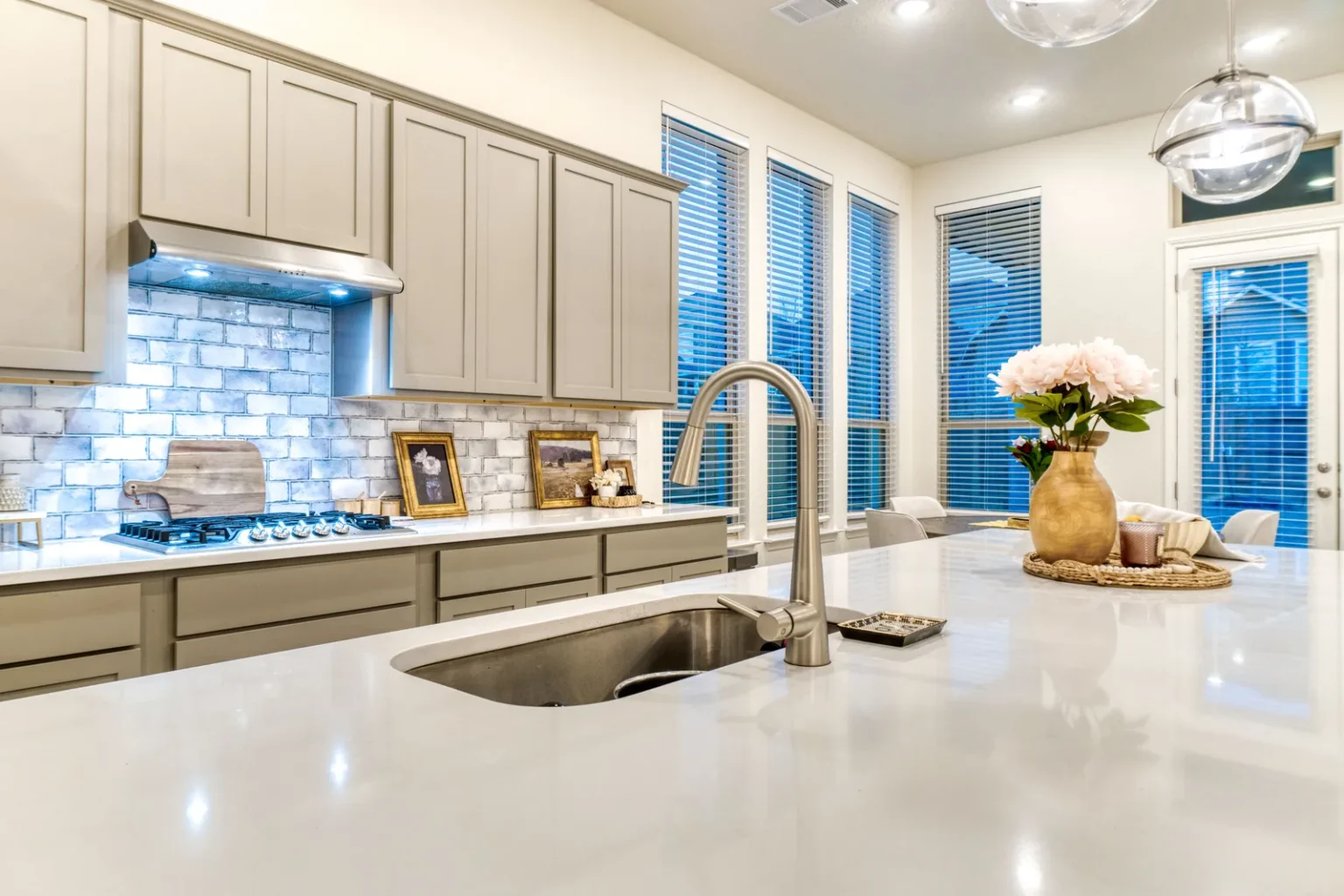 Island sink faucet brick backsplash in North Hollywood by Athenian Builders