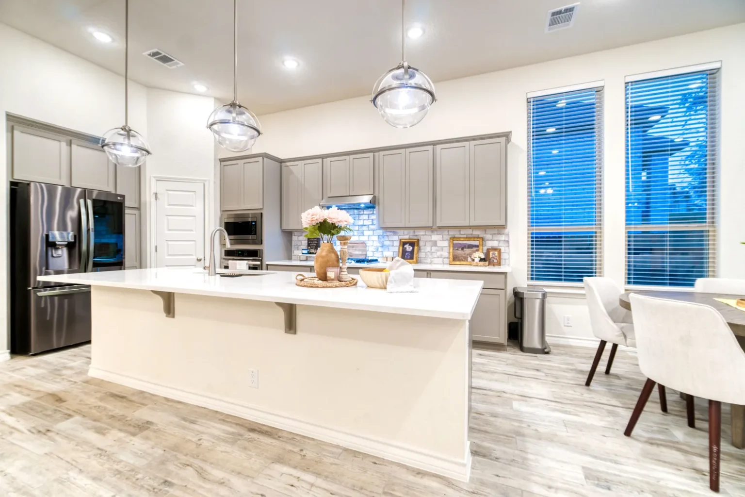 Kitchen island breakfast bar fridge wall in North Hollywood by Athenian Builders