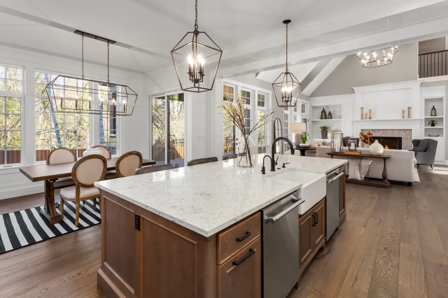 Kitchen island farmhouse sink dining area in Sherman Oaks by Athenian Builders