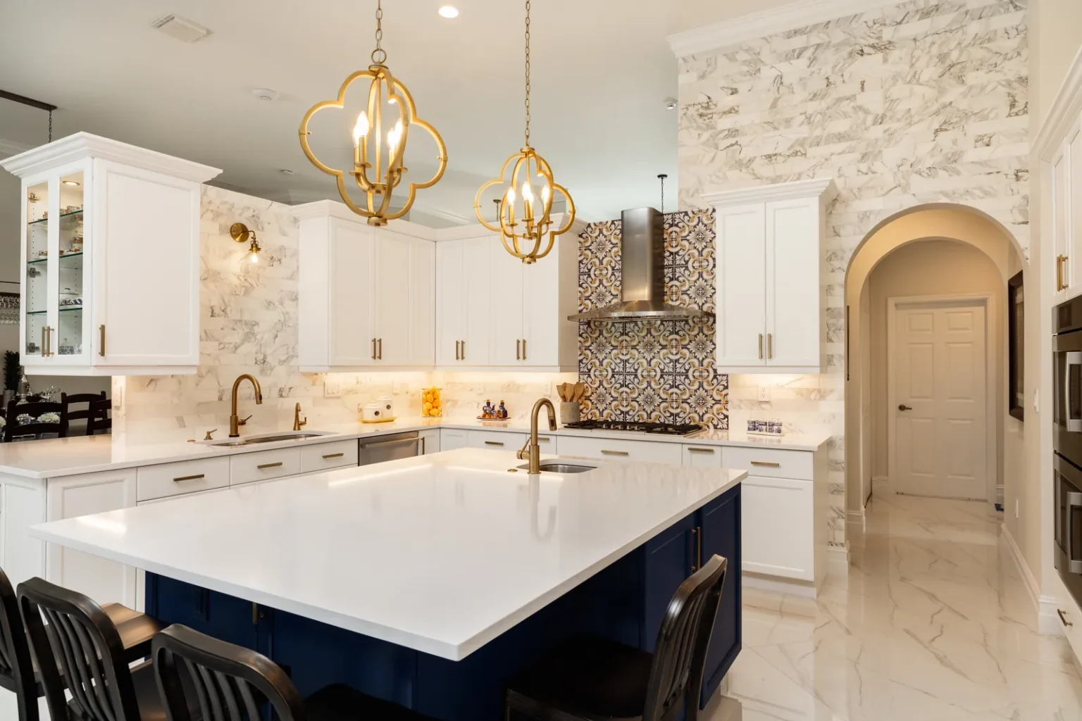 Kitchen marble accent wall arched doorway in Pacific Palisades by Athenian Builders