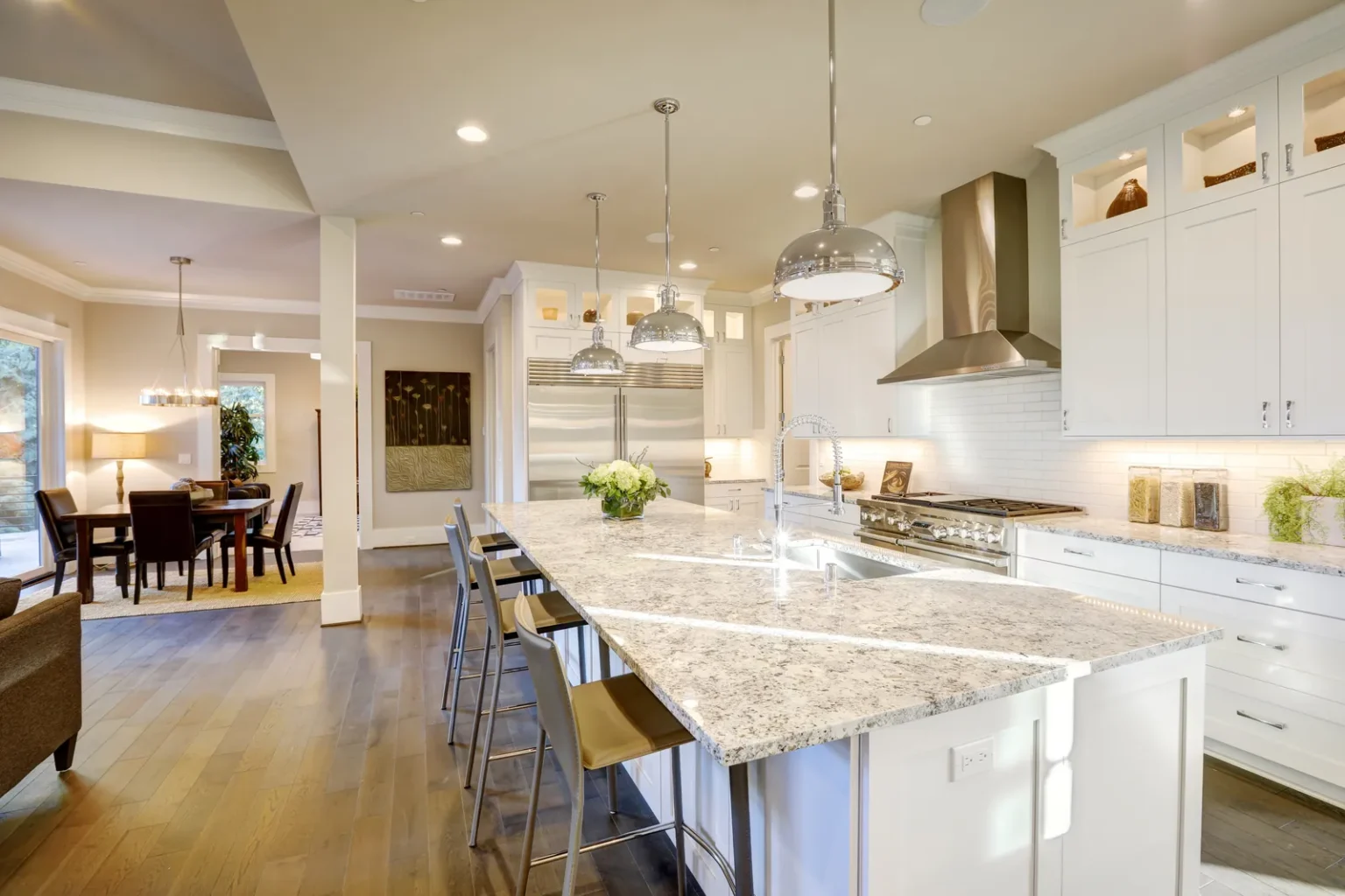 Open concept kitchen and dining in Studio City by Athenian Builders