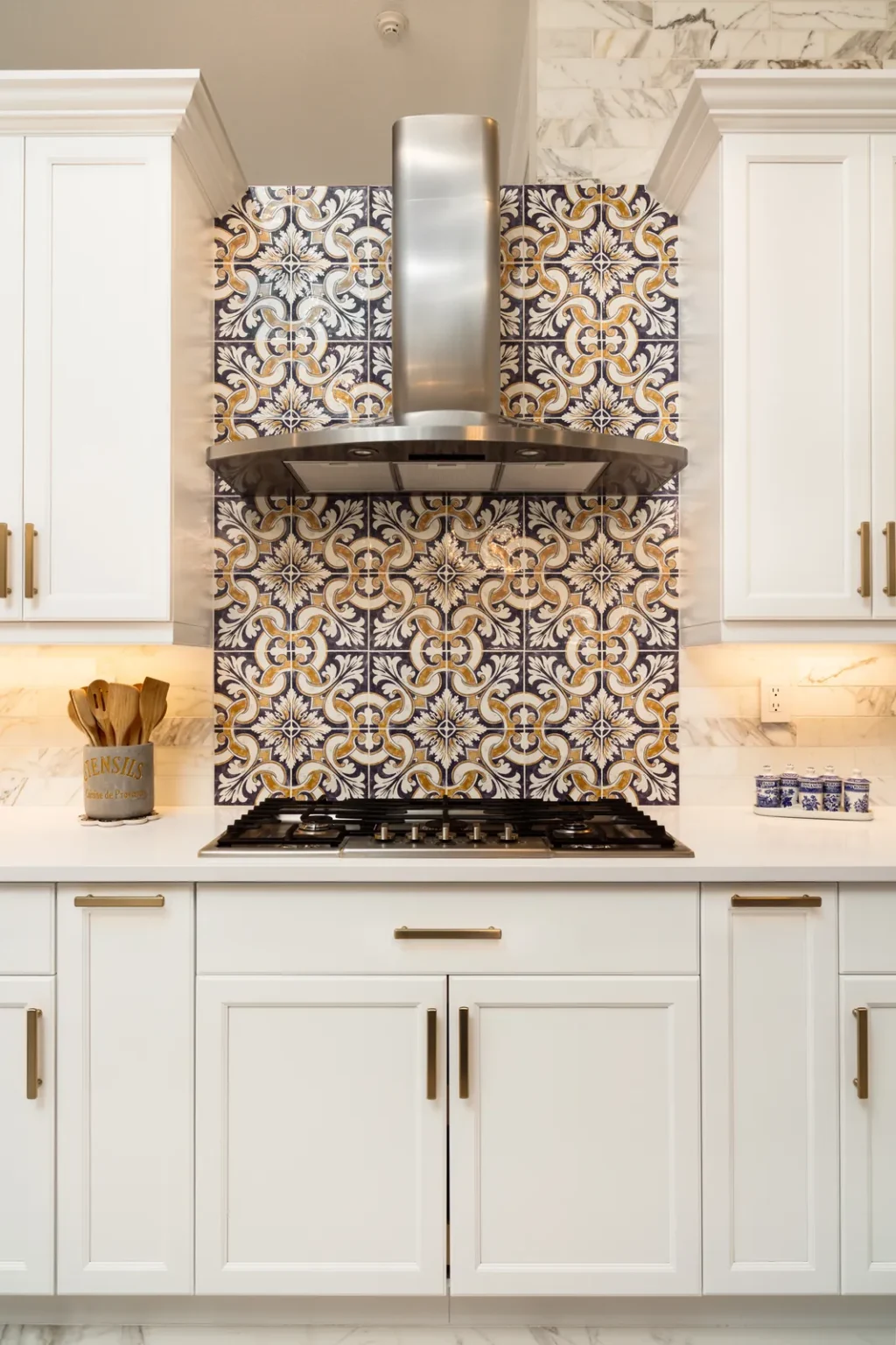 Patterned tile backsplash range hood in Pacific Palisades by Athenian Builders