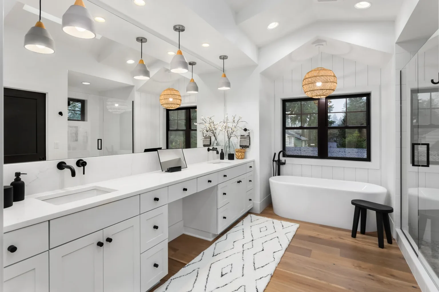 Primary bathroom double vanity freestanding tub in West Hollywood by Athenian Builders