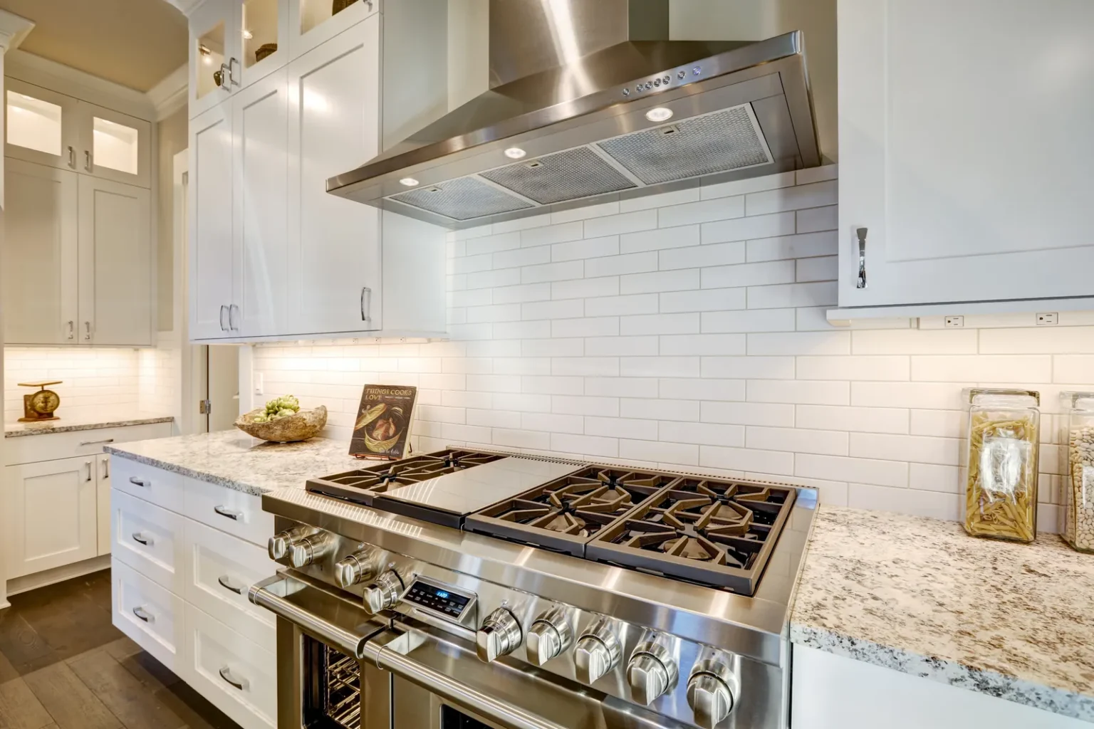 Pro range and hood subway tile backsplash in Studio City by Athenian Builders