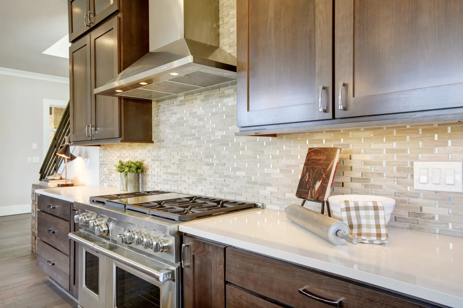Stainless range hood glass mosaic backsplash in Encino by Athenian Builders