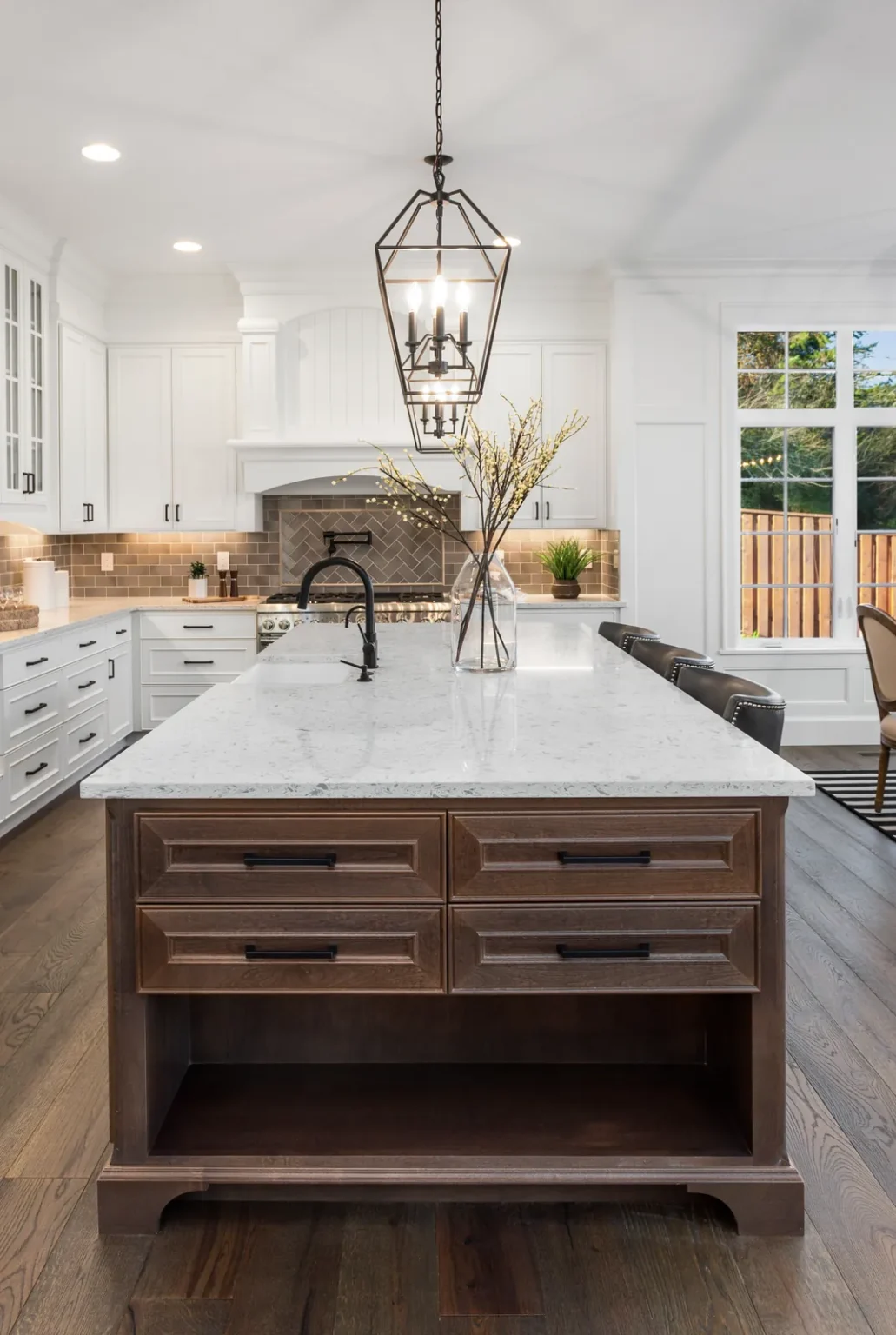 Wood kitchen island black cage pendants in Sherman Oaks by Athenian Builders